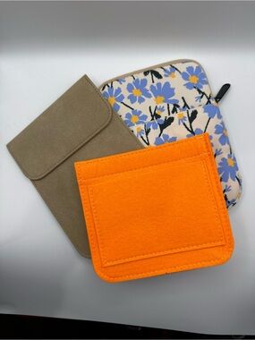 Bright Orange Felt Bag organizer with Floral Padded Bag and Suede Taupe pouch.